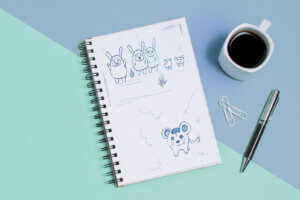 croquis sur bloc notes des personnages mascottes enfantins
